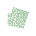Folded mint green Casting Queens fishing neck gaiter featuring white floral pattern design, lightweight women’s fishing apparel accessory for sun protection and outdoor adventures.