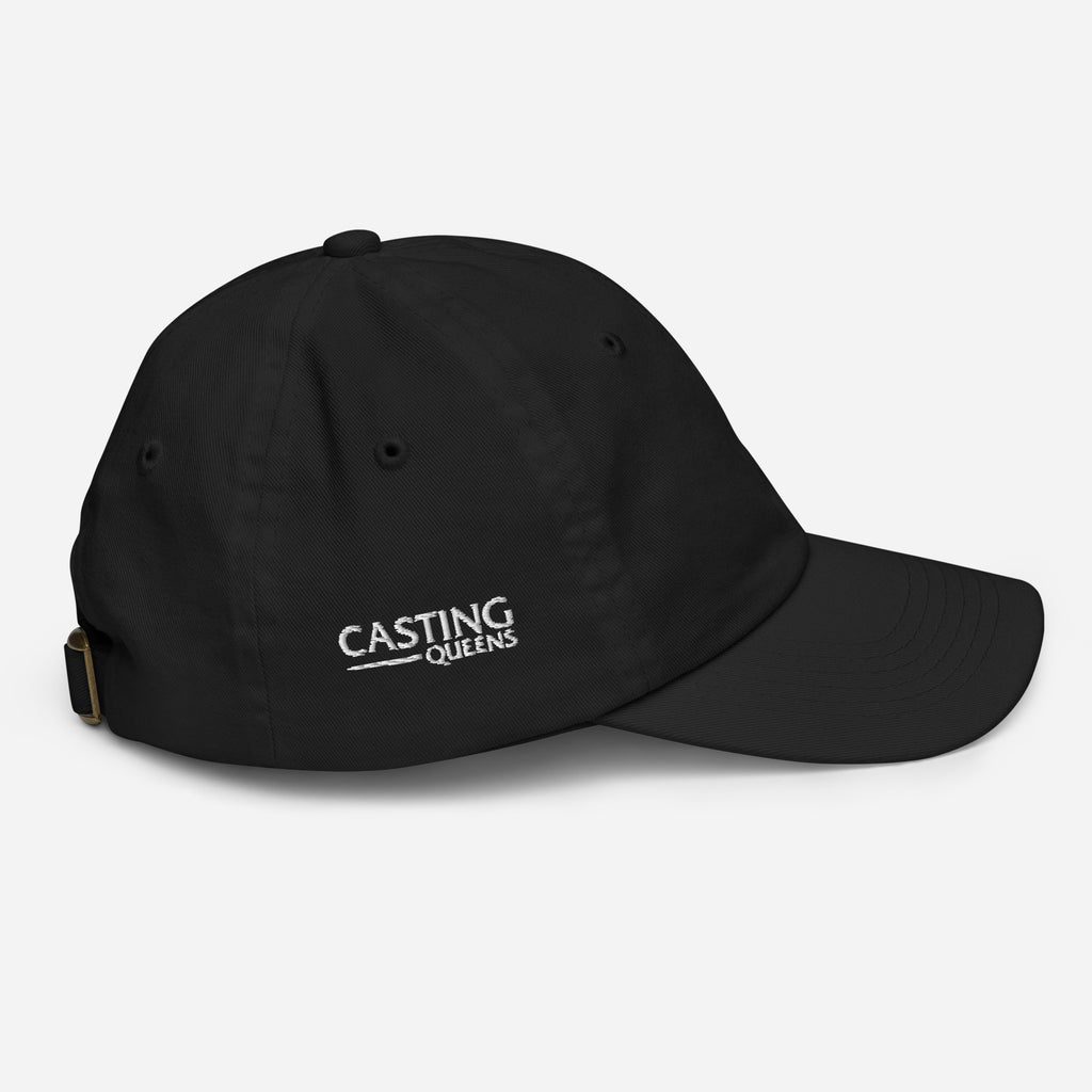 Black youth baseball cap with minimalist embroidered Casting Queens logo on the front.