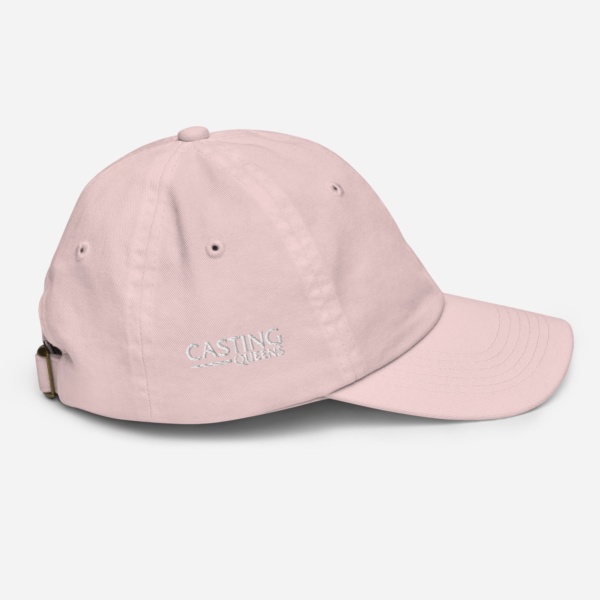 Side view of light pink youth baseball cap with small minimalist Casting Queens embroidery detail.